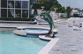 Custom Coping with 36-inch Spillway and Dolphin Fountains